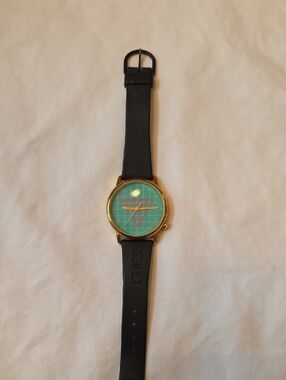 GUESS Vintage Gold-Case Watch with Black Rubber Strap & Teal Geometric Dial